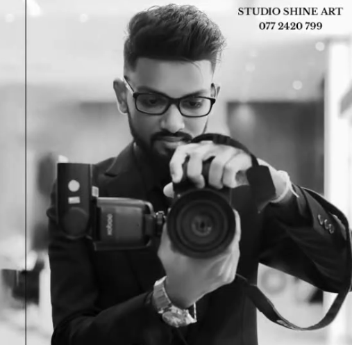 Portrait of the photographer holding a camera